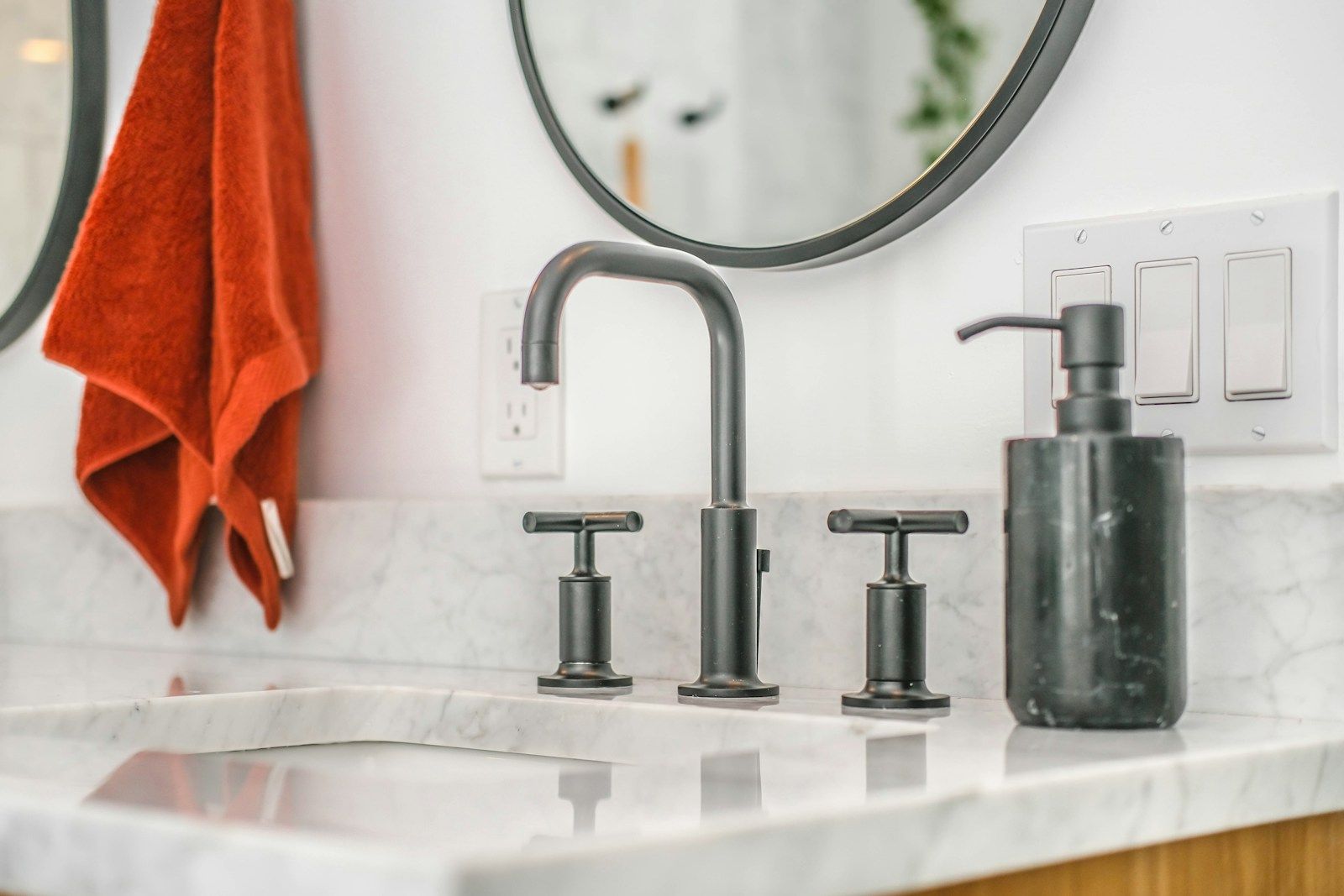 Chrome tap on a white ceramic basin