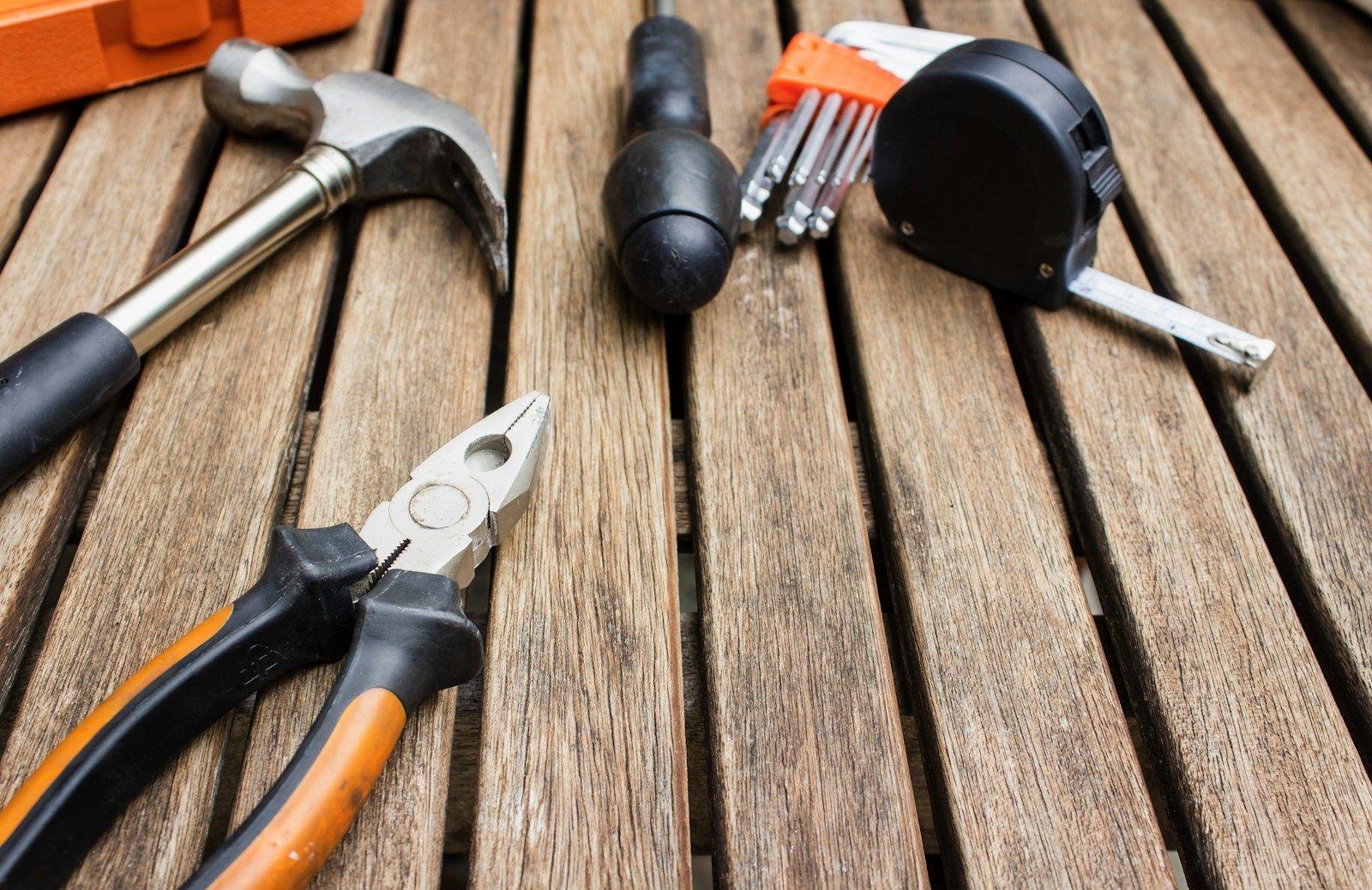 Carpentry tools laid out on a wooden surface